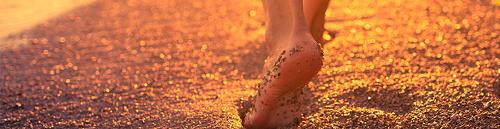 lady walking through sand, calming therapy image